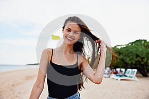 nature woman carefree ocean vacation sand smile beach summer young sea