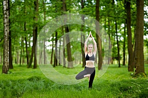 Nature yoga session in woods photo