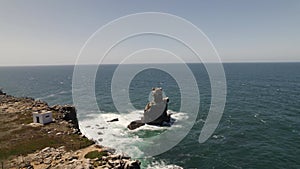 Nau dos Corvos or Ship of Crows, Carvoeiro cape, Peniche in Portugal. Aerial circling