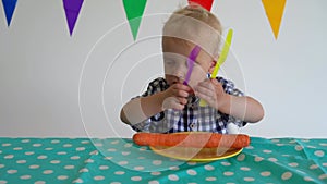 Naughty boy throw away carrot from plate by the table. Gimbal motion shot.