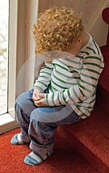 Naughty child in Time Out photo