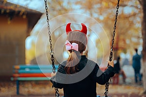 Naughty Disobedient Little Child Wearing Devil Horns Playing Alone