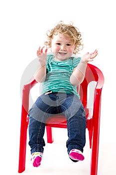 Naughty toddler on chair
