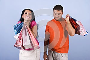Naughty and vanity woman with shopping bags photo