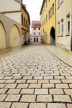 Naumburg, a quiet cobblestone street with beautiful old houses. Germany