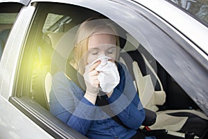 Nausea during a car trip. A blonde woman suffers from kinetosis. The concept of motion sickness in diseases of the transport and