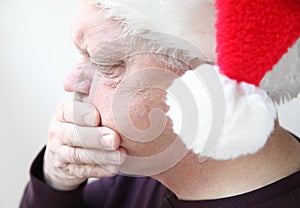 Nauseated senior in holiday hat