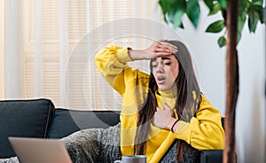 Nauseous young woman, feeling pain in her head and chest