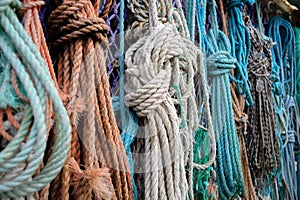 Nautical background. Closeup of old colorful mooring ropes , Old