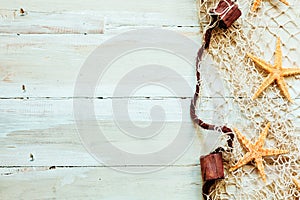 Nautical border on light beige wooden boards