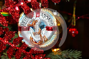 Nautical Christmas Ornament with anchor that says Welcome Aboard on Chistmas tree photo