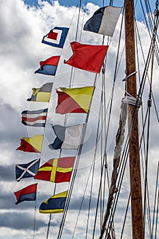Nautical flags on the mast of a sailboat