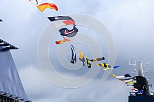 Nautical Flags Under Clouds