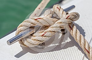 Nautical knot rope tied around stake on boat or ship