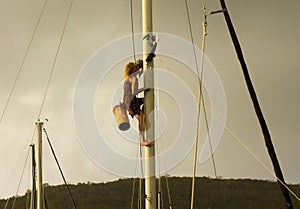 A nautical performer climbing a mast at admiralty bay, bequia