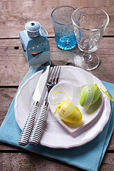 Nautical table setting on aged wooden background.
