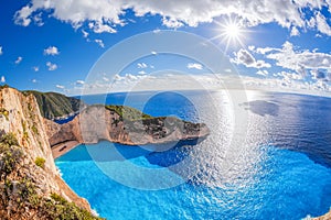 Navagio beach with shipwreck against sunset on Zakynthos island in Greece