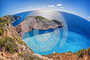 Navagio beach with shipwreck against sunset on Zakynthos island in Greece