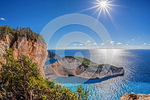 Navagio beach with shipwreck against sunset on Zakynthos island in Greece