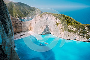 Navagio beach, Zakynthos island, Greece. Two tourist boats leaving Shipwreck bay with turquoise water and white sand