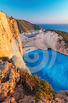 Navagio shipwreck beach Ã®n Zakynthos Greece at sunset