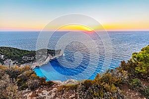 Navagio shipwreck beach Ã®n Zakynthos Greece at sunset
