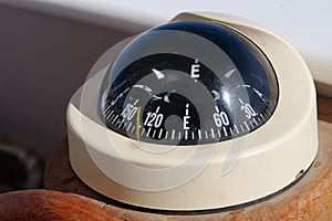 Naval compass on the ship