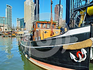 Naval maritime museum with ships and boats on water in the river at the port of rotterdam