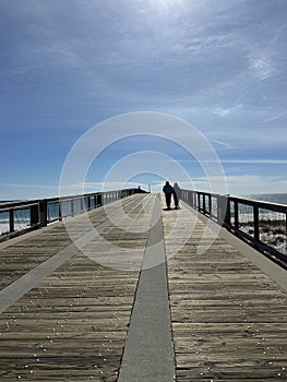 Navarre Beach Florida fishing pier with silhouette couple