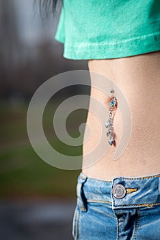 Navel piercing close up