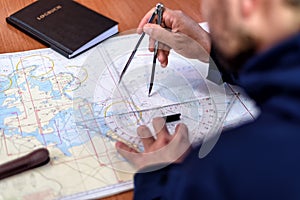 Navigation in the chart room on a sailing yacht