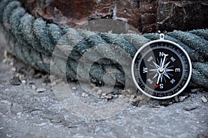 Navigation compass in outdoor with ropes