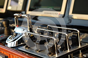 Navigation desk and engine control handle on the luxury big classical yacht.
