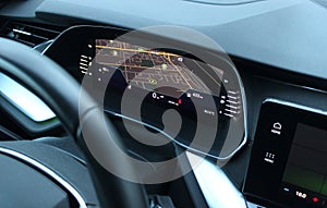 Navigation display on instrument cluster showing the car position on city map top view