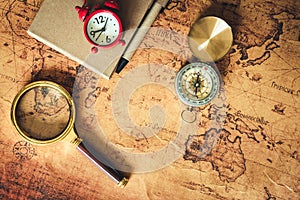 Navigation explore journey planning with compass magnifying glass and pocket watch layout on world map background., Expeditions photo