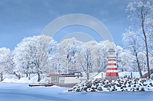 Navigation lighthouse on the winter coast