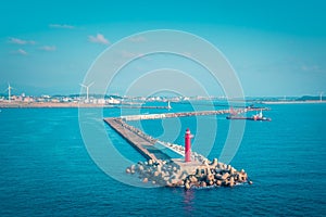 Navigation Ocean light house Takamatsu Bay, Japan. while the sun is setting. For Navigation and guiding concept