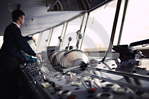 Navigation officer driving ship on the river.