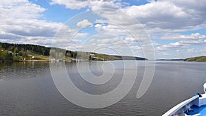 Navigation on the Russian Volga River. The ship sails along the Volga River, view from the deck.