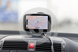 Navigation system hangs on a car windshield