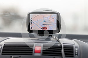 Navigation system hangs on a car windshield