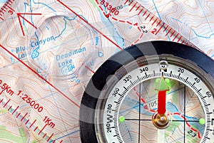 Navigational Compass on Topographical Map photo