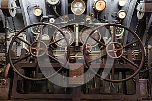 Navigational instruments and steering wheels of an old submarine