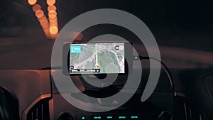 Navigator in a car while driving in the night close-up