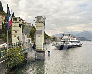The Navigazione Laghi car ferry Ghisallo approaching the dock at Varenna for a trip to Menaggio.