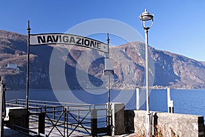 The Navigazione sign on the ferry boat boarding zone docking of Abbadia Lariana on Como Lake photo