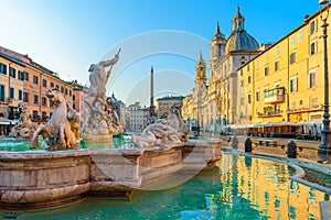 Navona Square or Piazza Navona in Rome, Italy with fountain. Rome architecture and landmark at sunrise