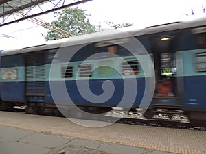 Navsari railway station - Indian rail service - moving train