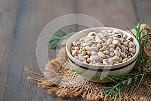 navy bean or white kidneys beans on wood background