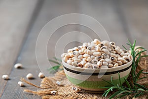 navy bean or white kidneys beans on wood background